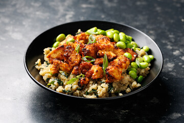 Sweet and sour tofu with spinach quinoa and steamed edamame beans. Healthy food.