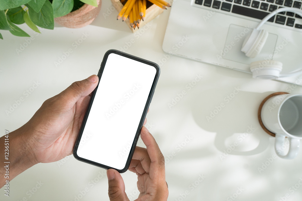 Poster close up of hands holding a smartphone with a blank screen, for showcasing app designs or user inter