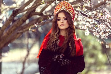 girl in national Russian red dress and kokoshnik