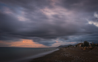 Sunrise on the beach of the city of Campofelice di Rosaria in northwestern Sicily. August 2024. Long exposure picture.