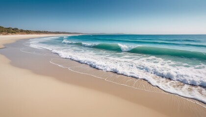 Fototapeta premium Serene Beach Scene with Turquoise Waves and White Sand