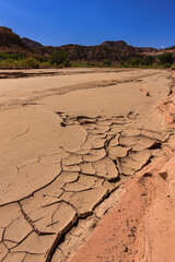 A desert landscape with a river that has dried up