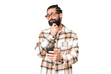 Young man with beard over isolated chroma key background thinking and sending a message