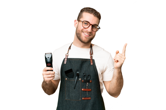 Barber man in an apron over isolated chroma key background showing and lifting a finger in sign of the best