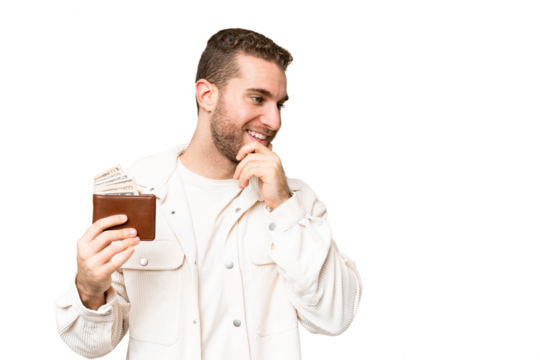 Young handsome blonde man holding a wallet over isolated chroma key background thinking an idea and looking side