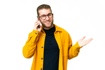 Young handsome blonde man over isolated chroma key background keeping a conversation with the mobile phone with someone