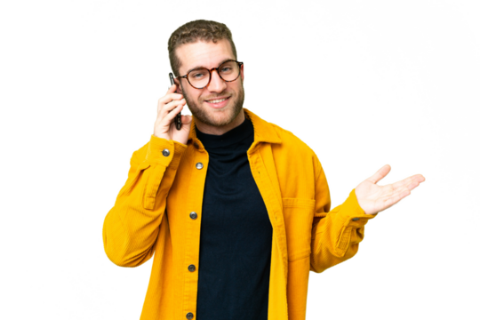 Young handsome blonde man over isolated chroma key background keeping a conversation with the mobile phone with someone