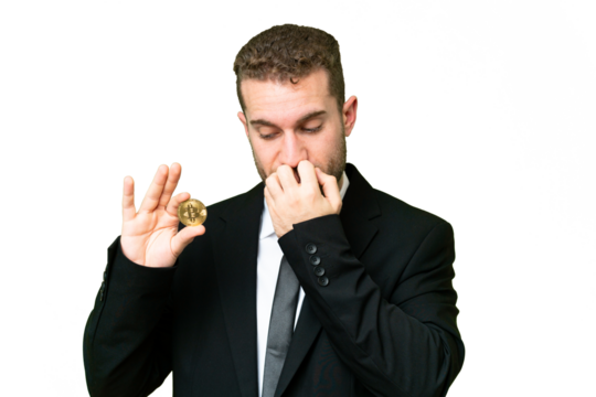 Young business blonde man holding a Bitcoin over isolated chroma key background having doubts