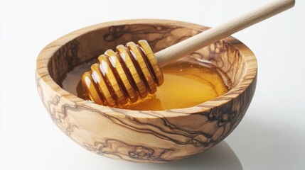 Honey with wooden honey dipper in wooden bowl isolated on white background