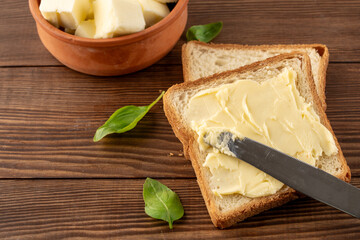 Butter that adds flavor to meals and is for breakfast on a wooden background