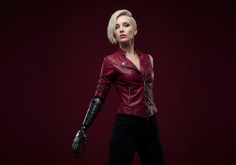 Fototapeta premium Futuristic portrait of a woman with stylish outfit and advanced robotic arm