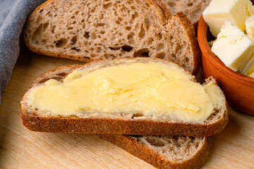 Butter that adds flavor to meals and is for breakfast on wooden background