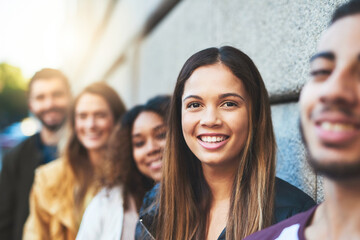 Line, students and woman with friends in city for university application, group and future. Queue, happiness and college freshman with people in new york for solidarity, support and education