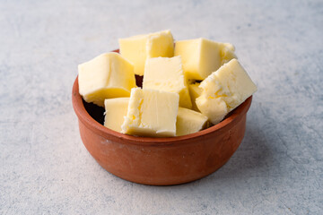 Butter that adds flavor to meals and is for breakfast on white  background