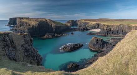 Stunning Coastal Panorama: Turquoise Waters and Rugged Cliffs of Scotland