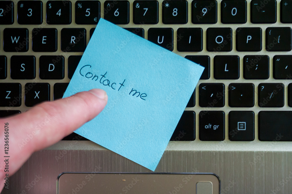 Poster a hand pointing at a sticky note with the message 