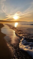 81. A quiet beach at sunrise, soft golden light reflecting on the water as waves gently roll in