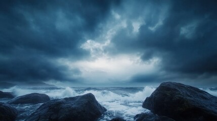 Obraz premium A dark, moody seascape featuring turbulent waves crashing against rocky shores under a stormy sky.