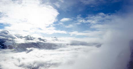 Blue sky with clouds and fog in winter Switzerland