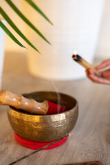 Meditation bowl and yoga mat. Time for yoga, meditation and relaxation. Breathing