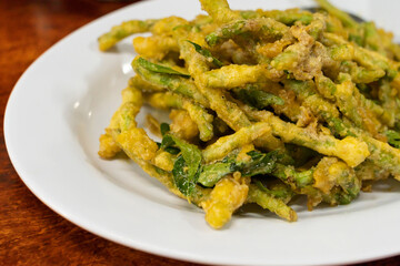 Deep fried french beans with salted duck egg yolk
