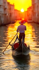 Obraz premium Gondolier Navigating Through Canals at Sunset in Venice, Italy Reflecting the Golden Sky