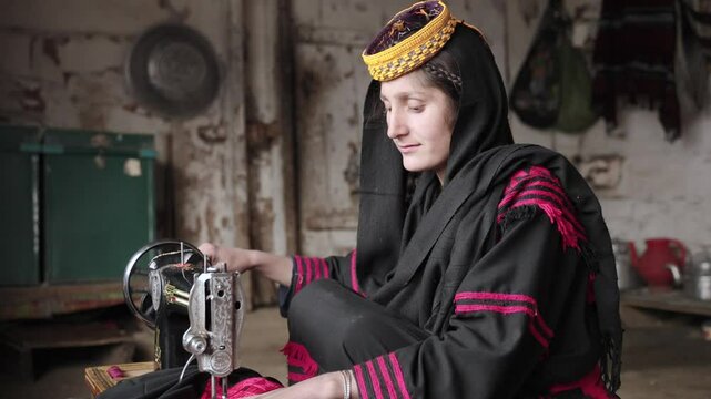 Portrait Young Kalashi Young Woman, Traditionally Dressed girl Sewing a Dress in Kalash Valley, Chitral, Pakistan.