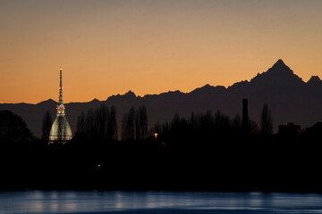 The Mole Antonelliana ant the Monviso in the Sunset in Turin.