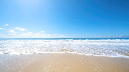 Fototapeta premium Sunny beach, ocean waves, clear sky, summer vacation background