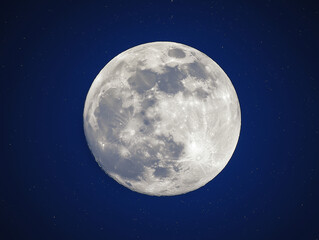 A large, full moon is shining brightly in the night sky