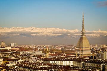 Torino landscape with the iconic Mole Antonelliana and the Intesa Sanpaolo skyscraper.