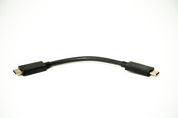 USB cable connecting devices in a tech workspace setup