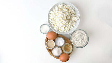 Ingredients for homemade baking, including cottage cheese, eggs, flour, and sugar, evoke holiday baking and traditional recipes
