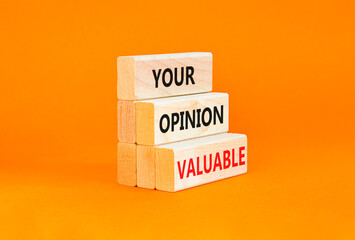 Your opinion valuable symbol. Concept words Your opinion valuable on beautiful wooden blocks. Beautiful orange table orange background. Business your opinion valuable concept. Copy space.