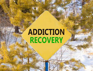 Addiction recovery symbol. Concept words Addiction recovery on beautiful yellow road sign....