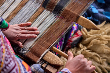 The hands of a weaver hold generations of skill, patience, and creativity, turning simple strands into works of art. Each weave is a journey, each knot a memory.  Chinchero Cusco Peru.