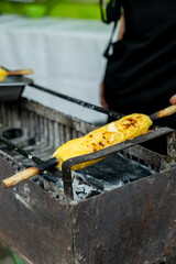 vertical latin man preparing traditional bolivian food called sonso - street food concept