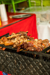 vertical skewers with meat, vegetables and charcoal grilled chicken in the streets of the city of...