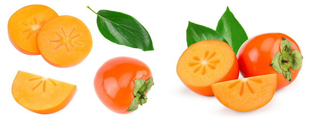 sliced ripe persimmon with green leaves isolated on white background. clipping path