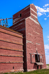A red brick building with a large chimney
