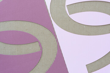 paper stencils with arc shape cutouts on corrugated paper