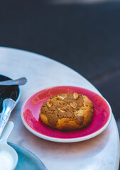 Chocolate, Vanilla, and Nut Cookie on Pink Plate – Outdoor Café in Paris