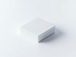 Fototapeta premium A white box mockup with no text or graphics on it, isolated on a white background. The box is rectangular and has sharp edges, with the top surface facing forward for product photography. 
