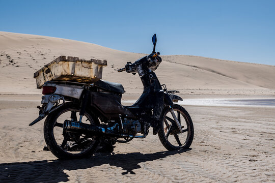 Pretty landscape with a fisherman's mobilette in the Dakhla desert in Morocco
