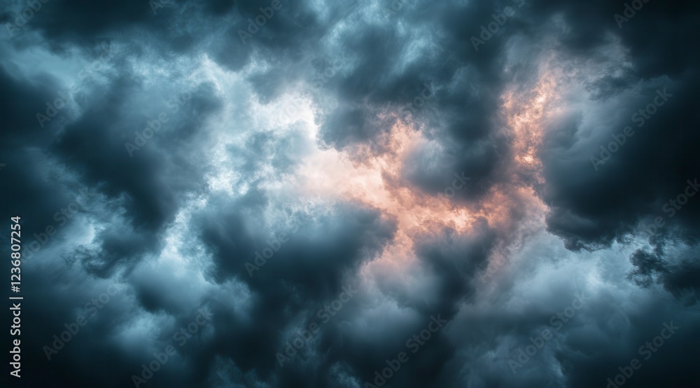 Poster dark and dramatic sky filled with stormy clouds. a hint of warm light peeks through the dense, gray 
