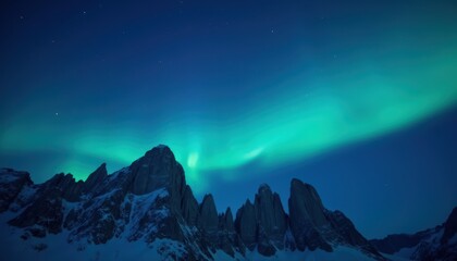 Ethereal Aurora Borealis Over Jagged Mountain Peaks at Nighttime