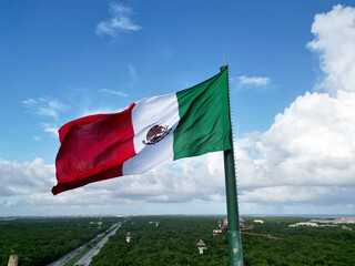 Mexican flag waving with blue sky and clouds in Mexico City - Flag Waving
