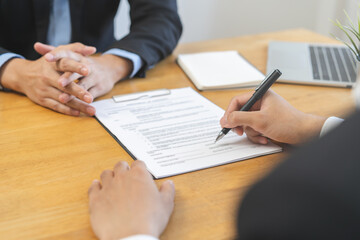 Business finance concept, teamwork and partnership asian businessman customer and salesman discussing client, hand sign sales contract with document at desk office. Lawyers working together at meeting