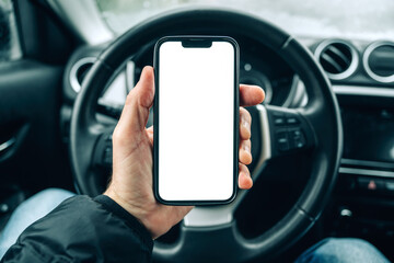 Smartphone mockup screen, male driver using mobile phone in car on cold winter day