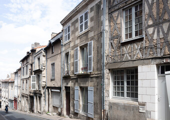 Old houses in the old street of Poitiers. France